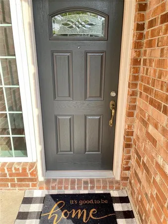 a view of a door and a window