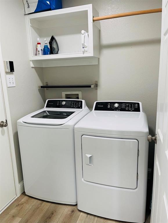 7848 Lancelot Road Frisco, TX 75035 - Photo 25 of 27 a utility room with dryer and washer