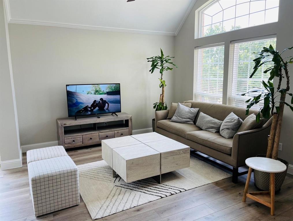 7848 Lancelot Road Frisco, TX 75035 - Photo 5 of 27 a living room with furniture and a flat screen tv