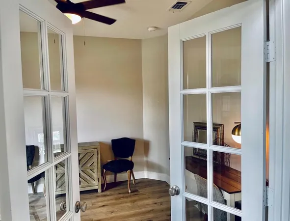 a view of a livingroom with furniture and wooden floor