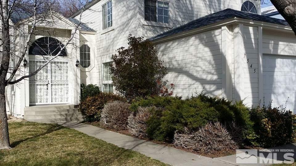 7545 Lighthouse Lane Reno, NV 89511 - Photo 1 of 1 a front view of a house with a yard
