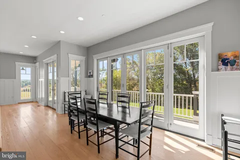 a kitchen with stainless steel appliances granite countertop a sink and a wooden floors