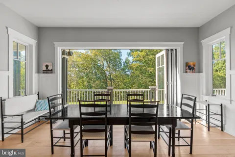 a kitchen with stainless steel appliances granite countertop a stove and wooden floors