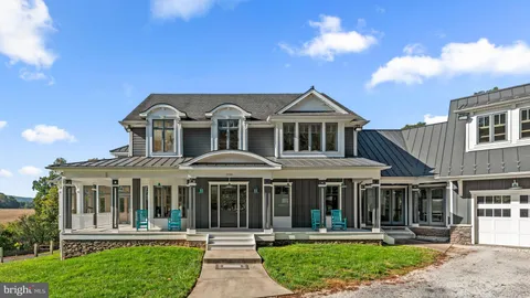 a front view of a residential apartment building with a yard