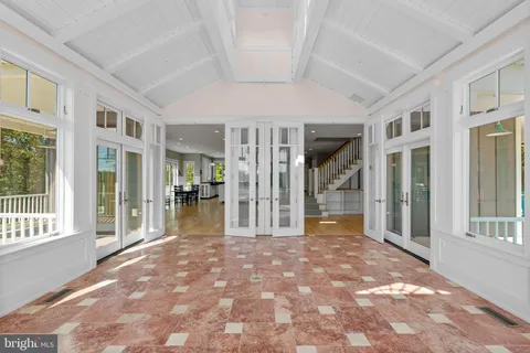 a bathroom with a sink mirror and toilet