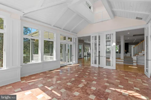 a view of a livingroom with an empty space and windows