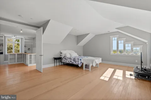 a bathroom with a toilet sink shower and mirror