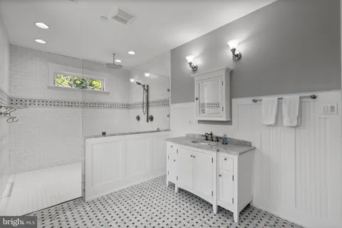 a view of a house with a big yard and potted plants