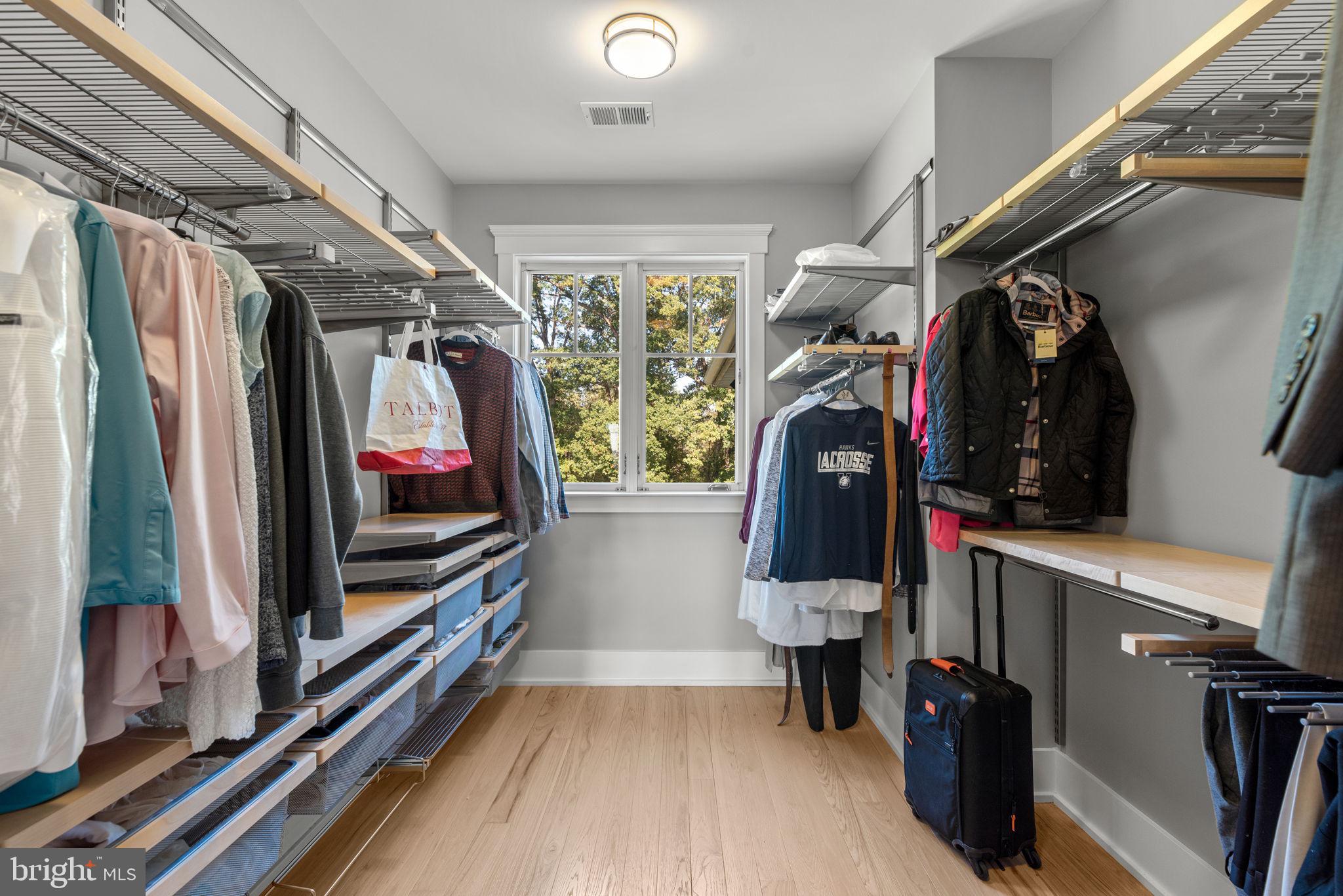 3216 Ramsland Way Frederick, MD 21704 - Photo 47 of 90 a view of walk in closet with clothes and shoes