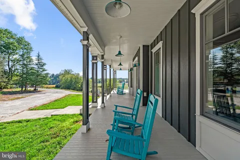 a view of an chair and tables in the balcony