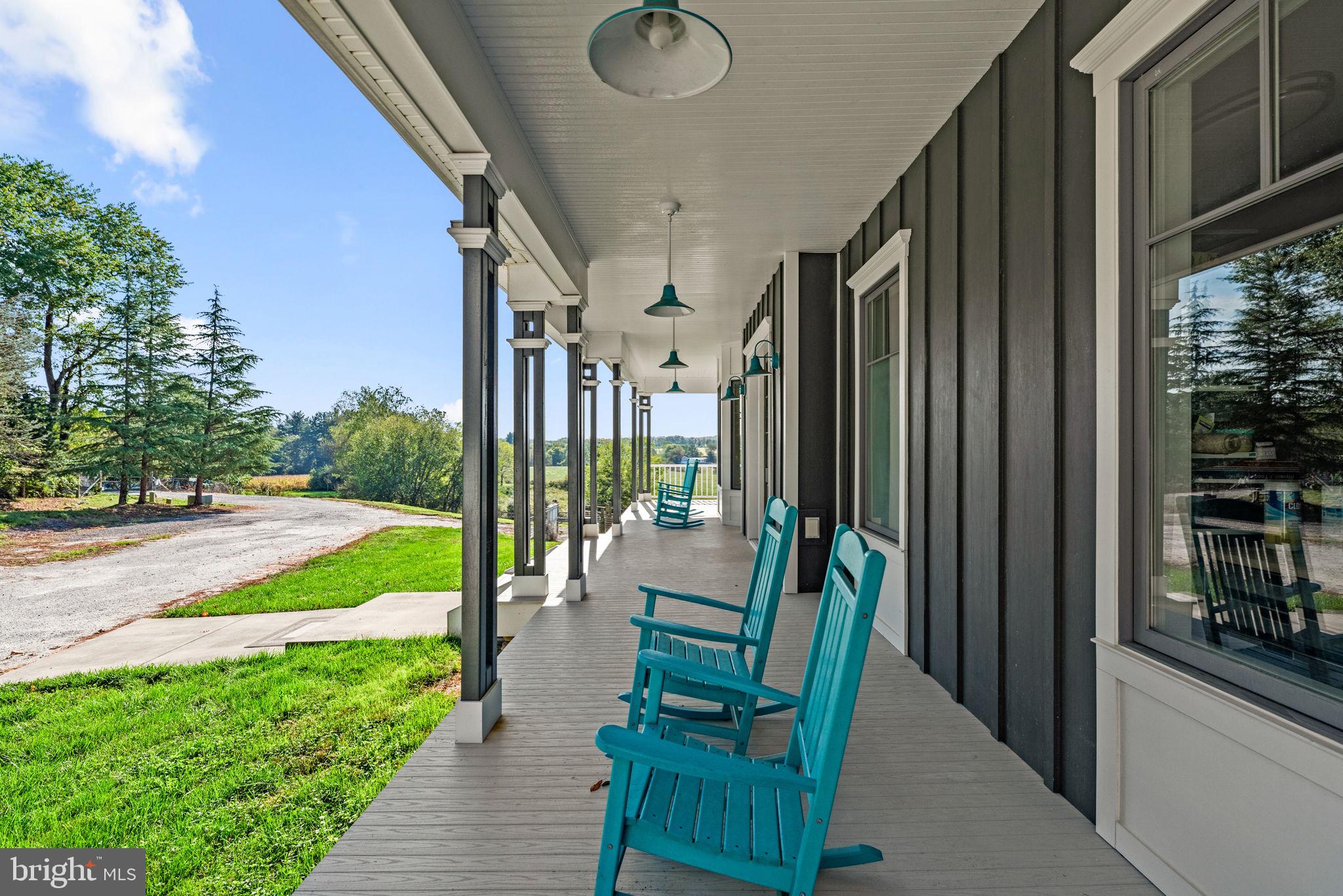 3216 Ramsland Way Frederick, MD 21704 - Photo 5 of 90 a view of an chair and tables in the balcony