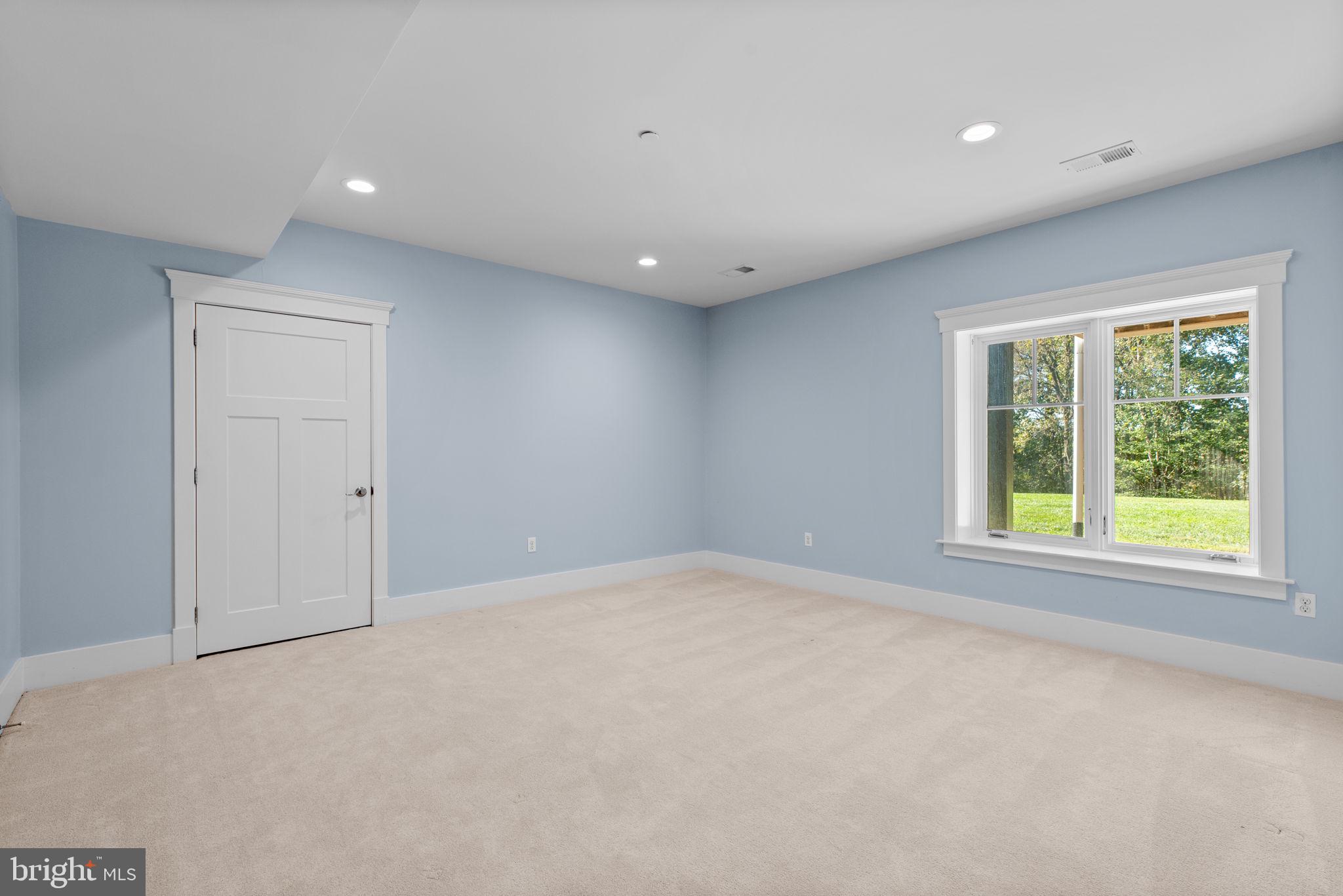 3216 Ramsland Way Frederick, MD 21704 - Photo 66 of 90 a view of an empty room with a window