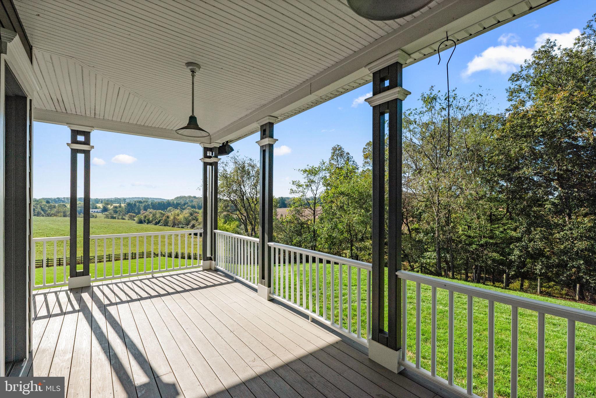 3216 Ramsland Way Frederick, MD 21704 - Photo 72 of 90 a view of a balcony with wooden floor