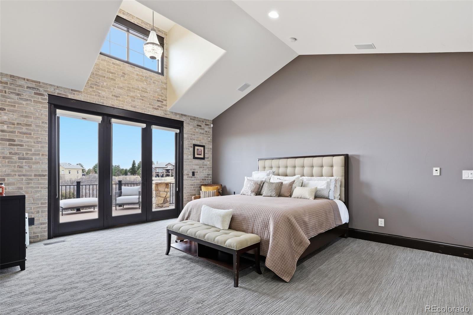 843 Diamond Ridge Circle Castle Rock, CO 80108 - Photo 16 of 31 a bedroom with a bed and a large window