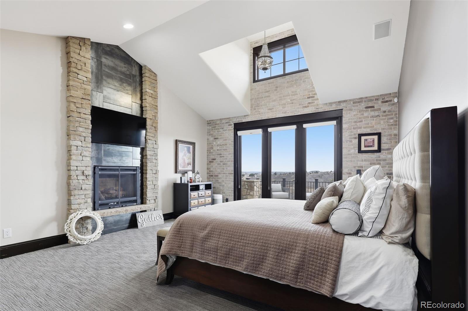 843 Diamond Ridge Circle Castle Rock, CO 80108 - Photo 17 of 31 a bedroom with a bed and a large window