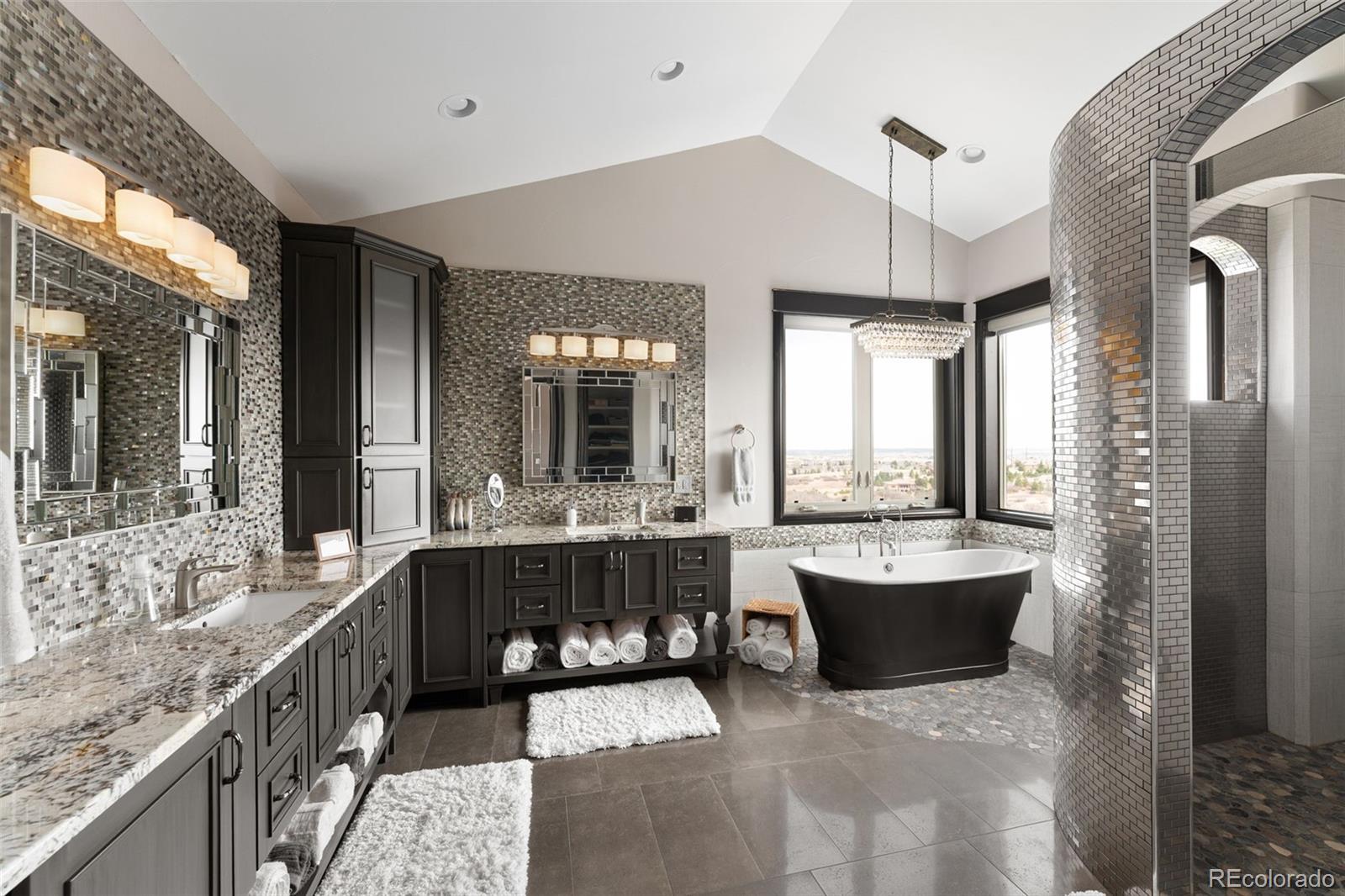 843 Diamond Ridge Circle Castle Rock, CO 80108 - Photo 18 of 31 a large bathroom with a large tub and sink