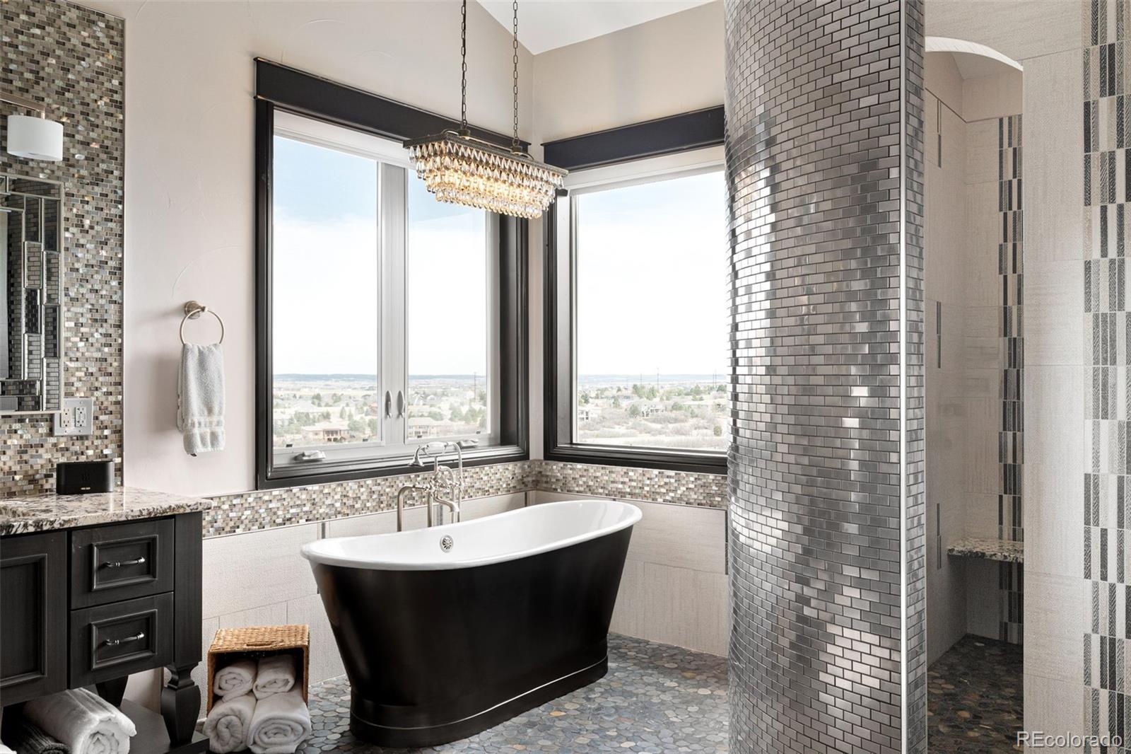 843 Diamond Ridge Circle Castle Rock, CO 80108 - Photo 19 of 31 a bathroom with a bathtub and a shower