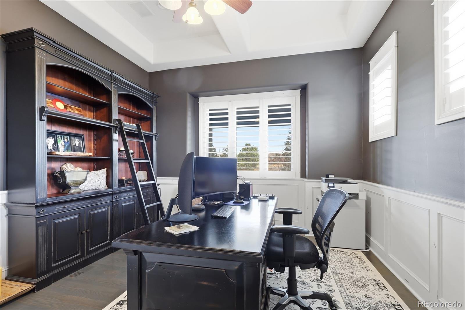 843 Diamond Ridge Circle Castle Rock, CO 80108 - Photo 20 of 31 a view of a workspace with furniture and a window