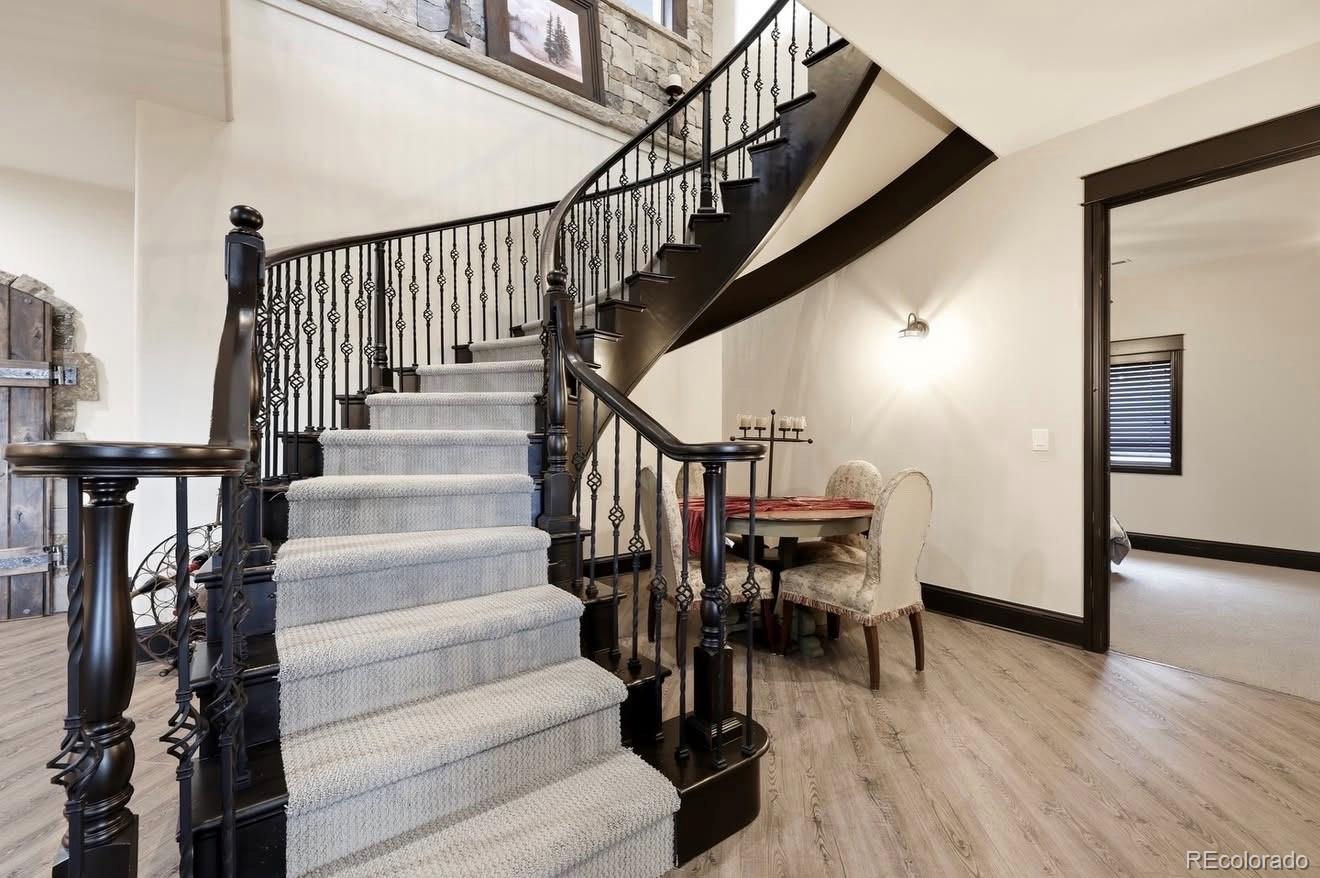843 Diamond Ridge Circle Castle Rock, CO 80108 - Photo 21 of 31 a view of entryway and hall with wooden floor