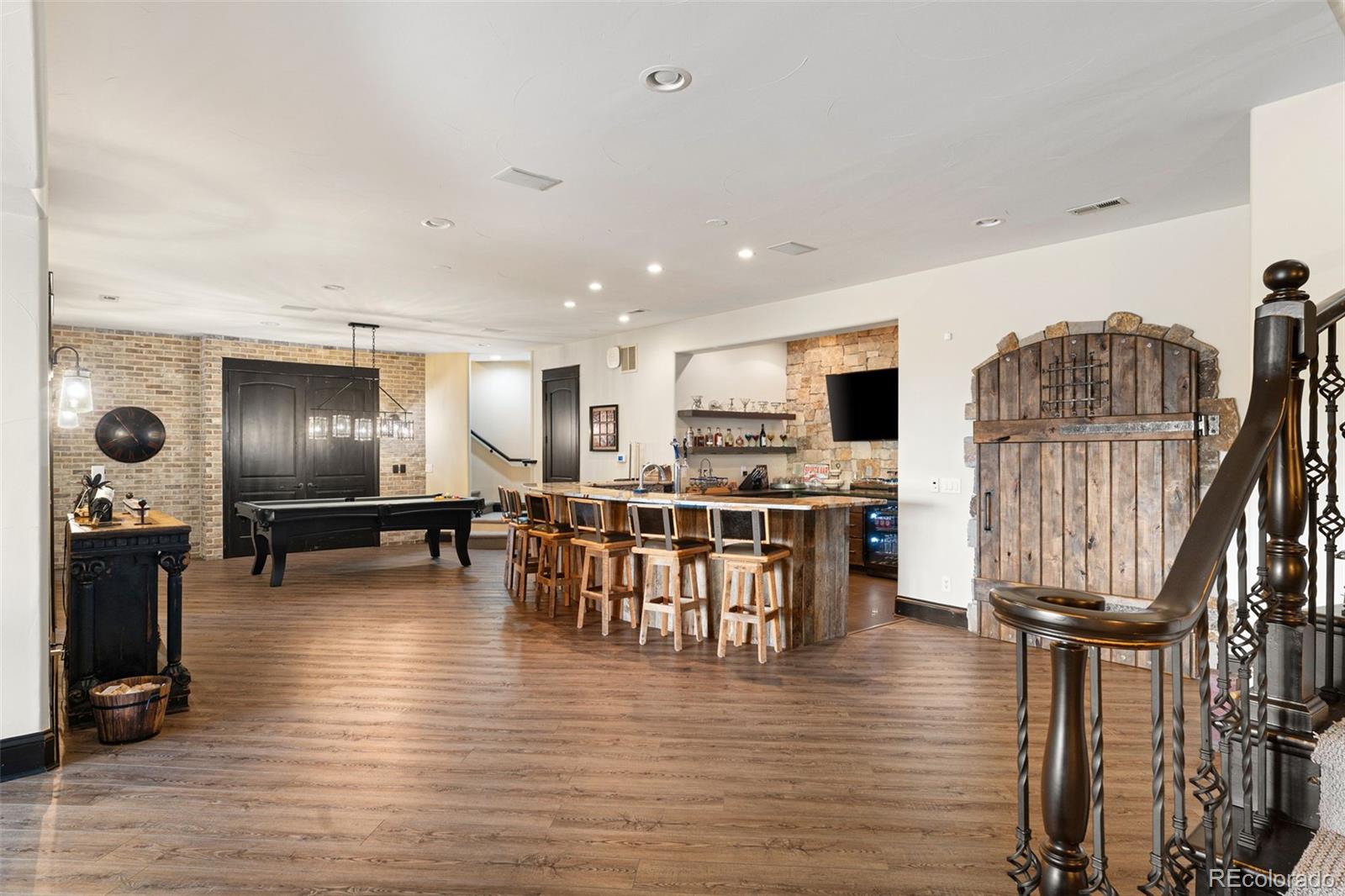 843 Diamond Ridge Circle Castle Rock, CO 80108 - Photo 23 of 31 a living room with furniture and a wooden floor