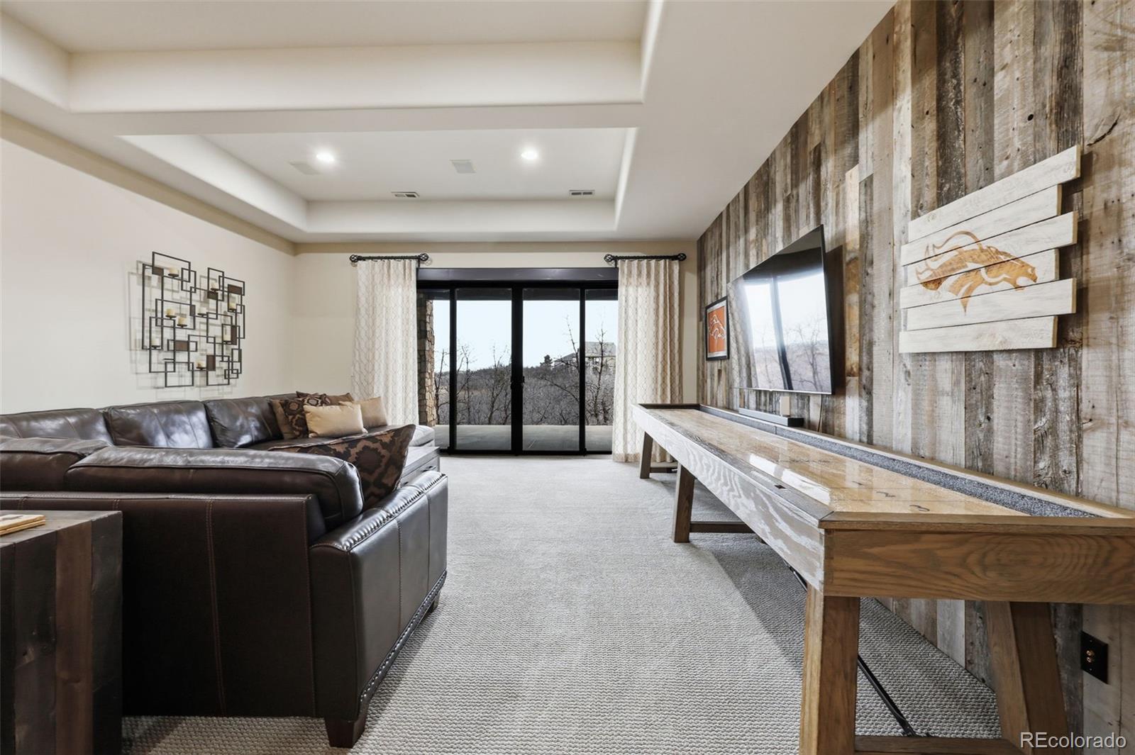 843 Diamond Ridge Circle Castle Rock, CO 80108 - Photo 25 of 31 a living room with furniture and a large window