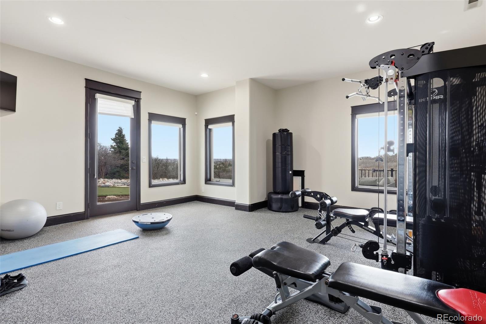 843 Diamond Ridge Circle Castle Rock, CO 80108 - Photo 26 of 31 a view of a room with gym equipment and large window