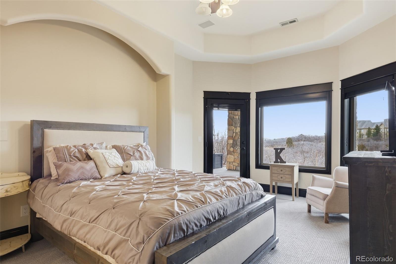 843 Diamond Ridge Circle Castle Rock, CO 80108 - Photo 28 of 31 a bedroom with a large bed and a large window
