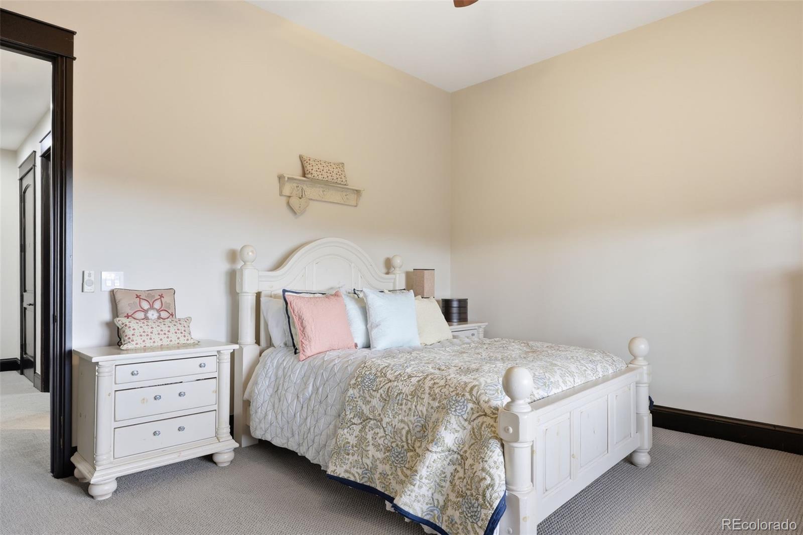 843 Diamond Ridge Circle Castle Rock, CO 80108 - Photo 29 of 31 a bedroom with a bed and dresser