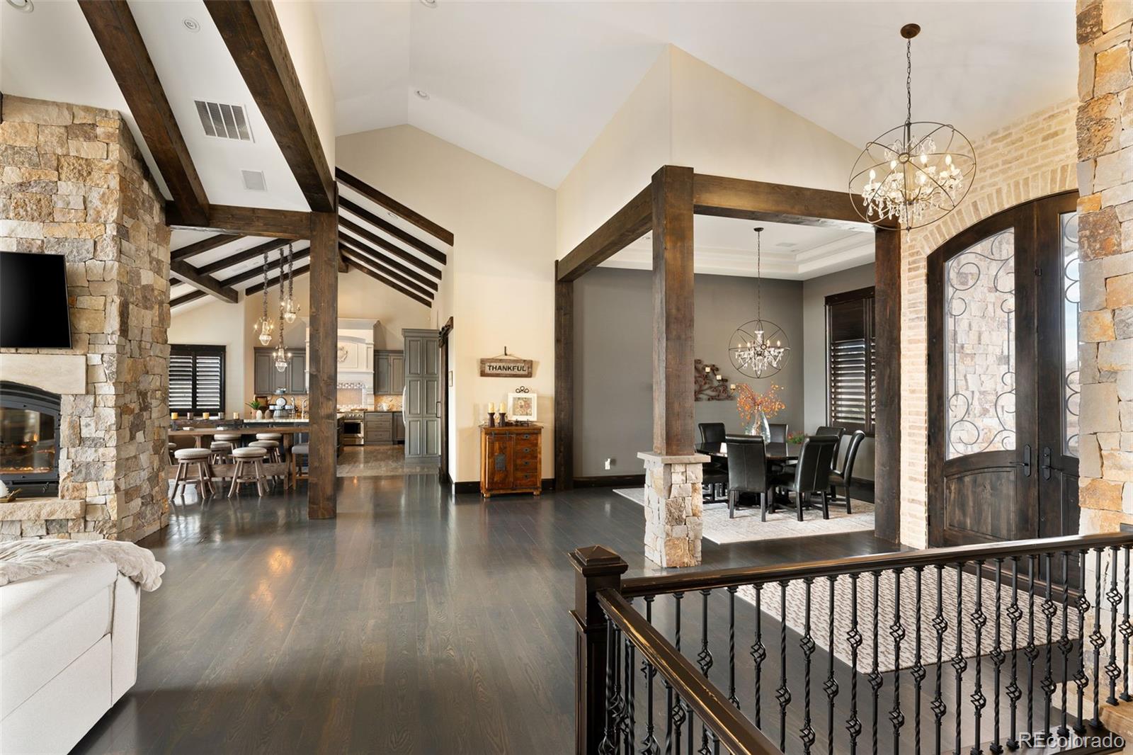 843 Diamond Ridge Circle Castle Rock, CO 80108 - Photo 7 of 31 a view of a dining room with furniture a chandelier and wooden floor