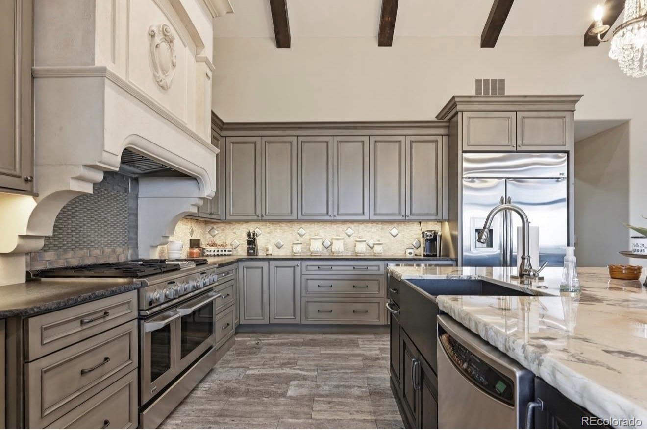 843 Diamond Ridge Circle Castle Rock, CO 80108 - Photo 9 of 31 a kitchen with granite countertop a sink stainless steel appliances and cabinets