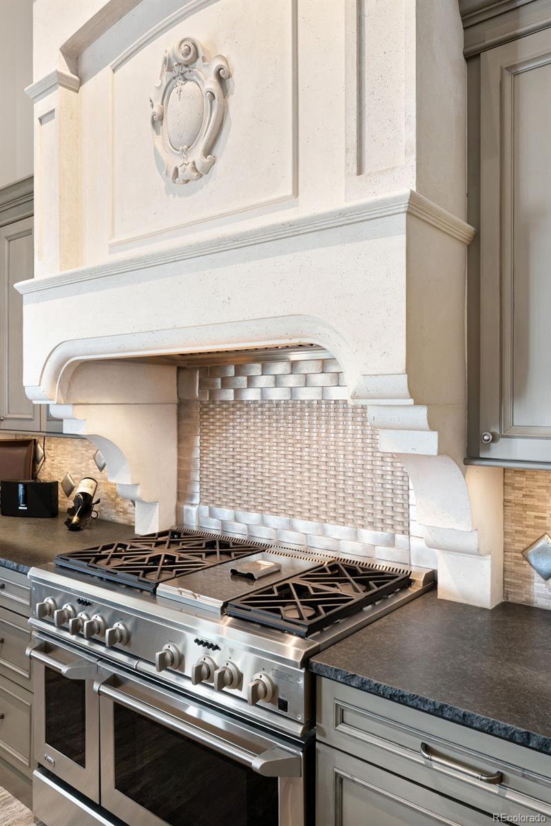 843 Diamond Ridge Circle Castle Rock, CO 80108 - Photo 10 of 31 a stove top oven sitting inside of a kitchen