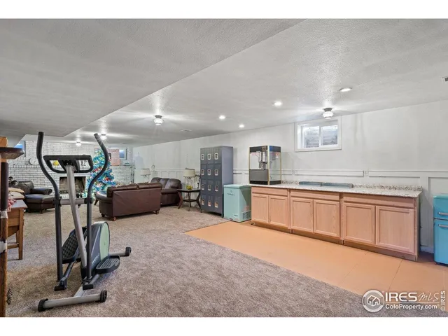 a view of a living room kitchen with furniture and a window