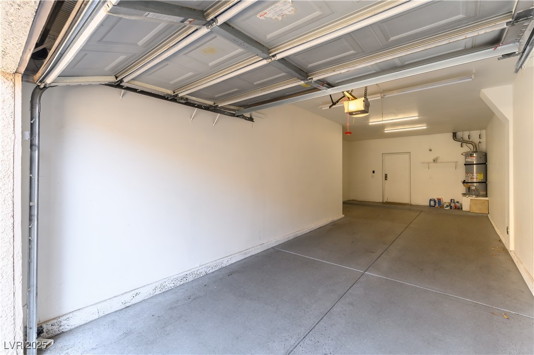 10550 West Alexander Road, Unit 1156 Las Vegas, NV 89129 - Photo 31 of 35 Huge Tandem 2 car garage with extra storage space and 60 gallon hotwater heater