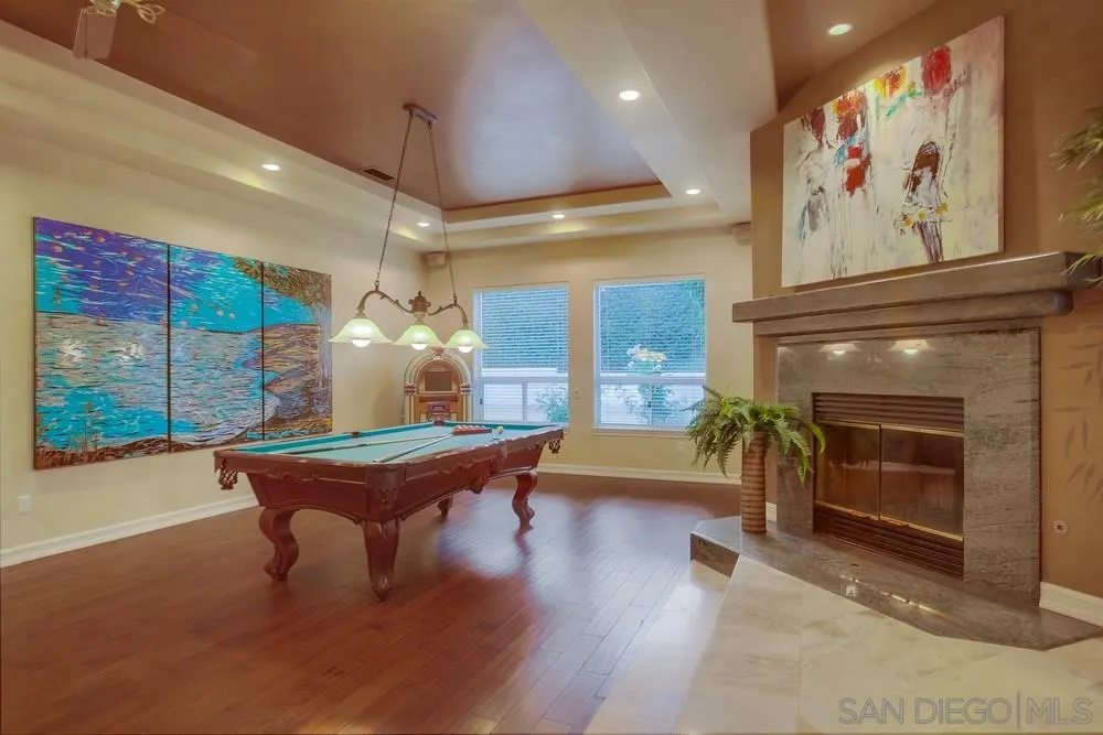 13409 Highlands Ranch Road Poway, CA 92064 - Photo 12 of 24 a living room with furniture a large window and a fireplace
