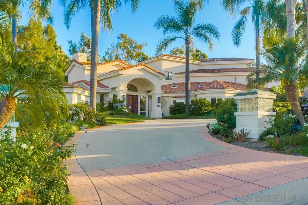 13409 Highlands Ranch Road Poway, CA 92064 - Photo 3 of 24 a view of a white house with a swimming pool and wooden bench