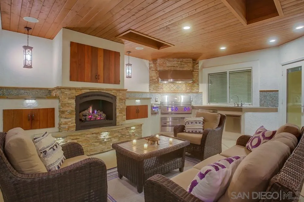 13409 Highlands Ranch Road Poway, CA 92064 - Photo 4 of 24 a living room with furniture and a fireplace