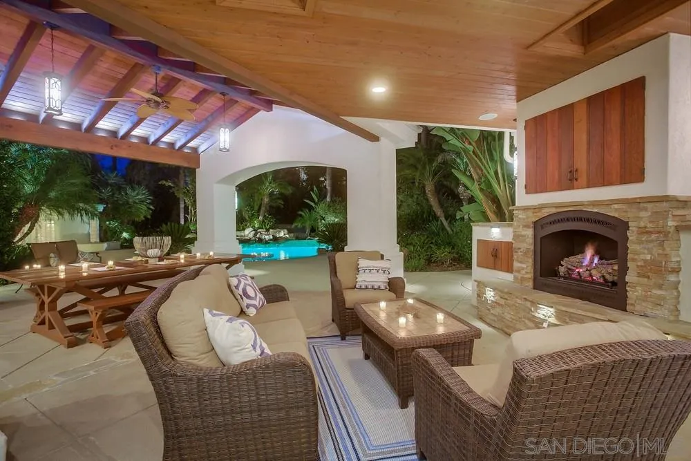 13409 Highlands Ranch Road Poway, CA 92064 - Photo 5 of 24 a living room with furniture a fireplace and a floor to ceiling window