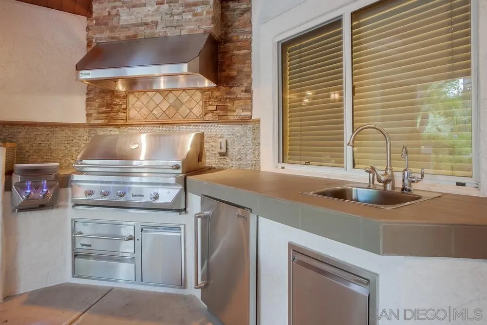 13409 Highlands Ranch Road Poway, CA 92064 - Photo 6 of 24 a kitchen with a stove and a sink