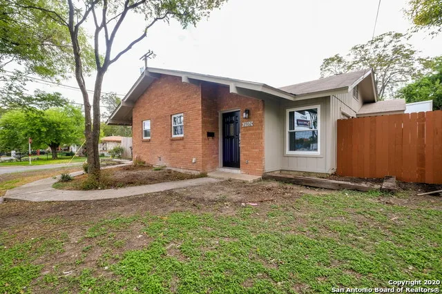 a house with yard in front of it