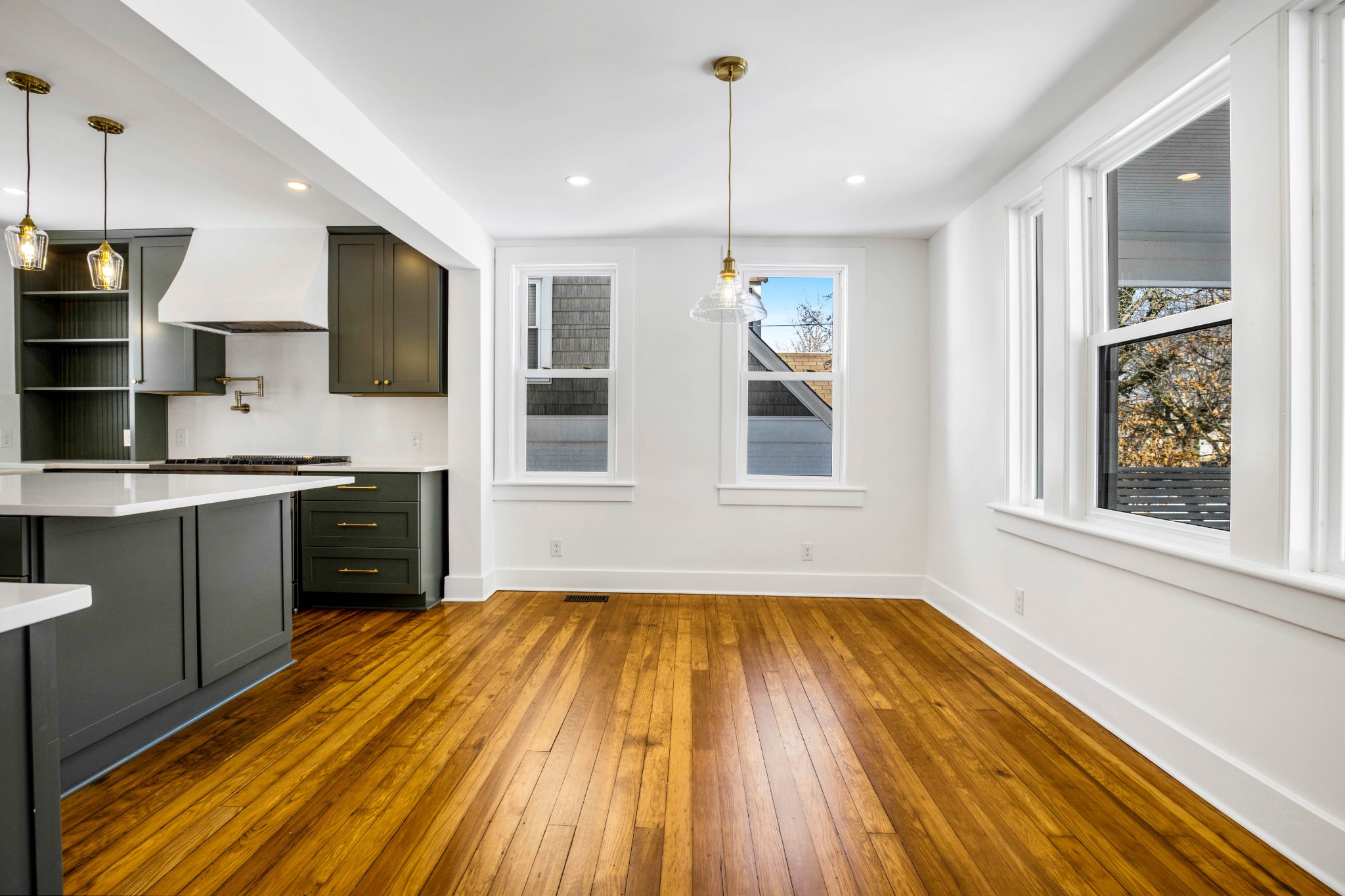 325 North Walnut Street Springfield, TN 37172 - Photo 13 of 34 a large kitchen with stainless steel appliances granite countertop a stove and a wooden floors