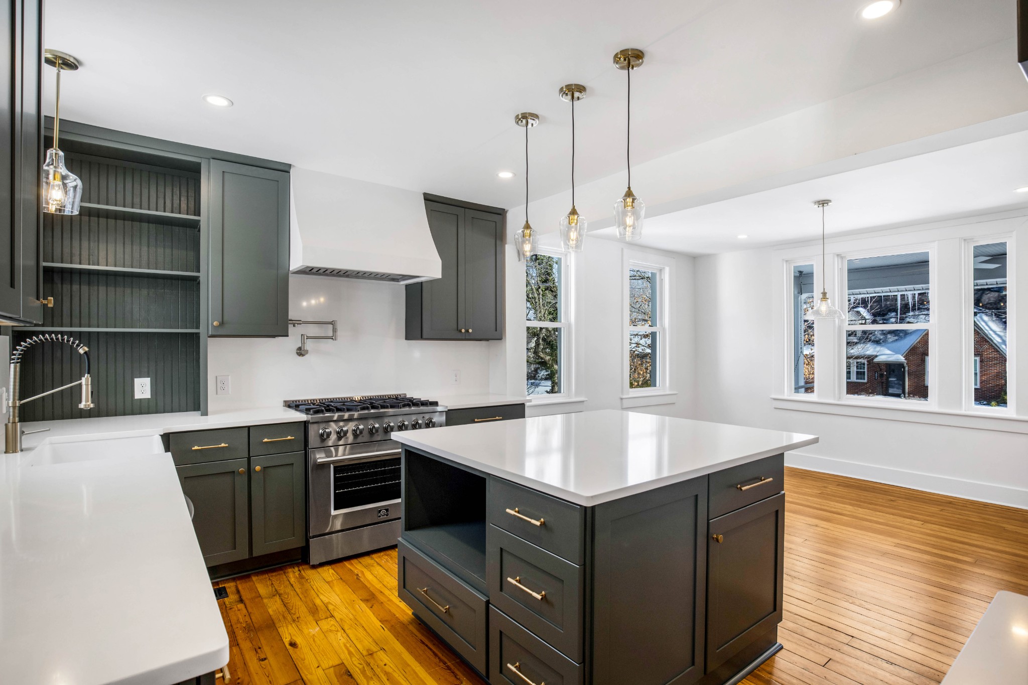 325 North Walnut Street Springfield, TN 37172 - Photo 17 of 34 a kitchen with stainless steel appliances granite countertop a sink a stove and a wooden floors