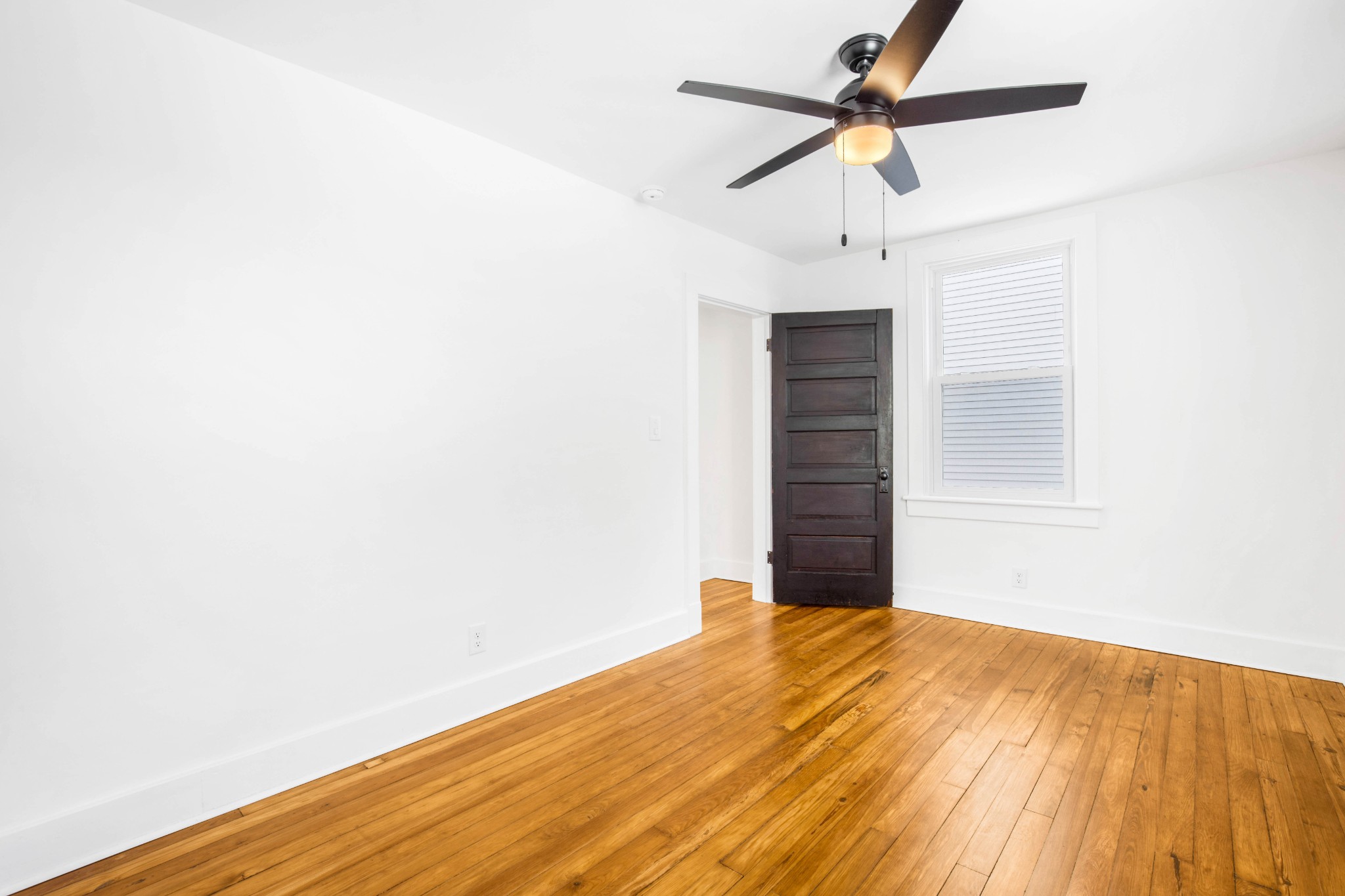 325 North Walnut Street Springfield, TN 37172 - Photo 21 of 34 a view of a room with a ceiling fan and wooden floor