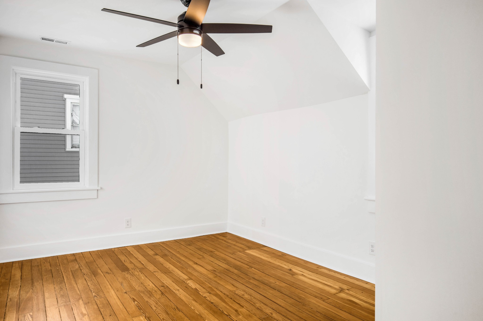325 North Walnut Street Springfield, TN 37172 - Photo 25 of 34 an empty room with a window and a ceiling fan