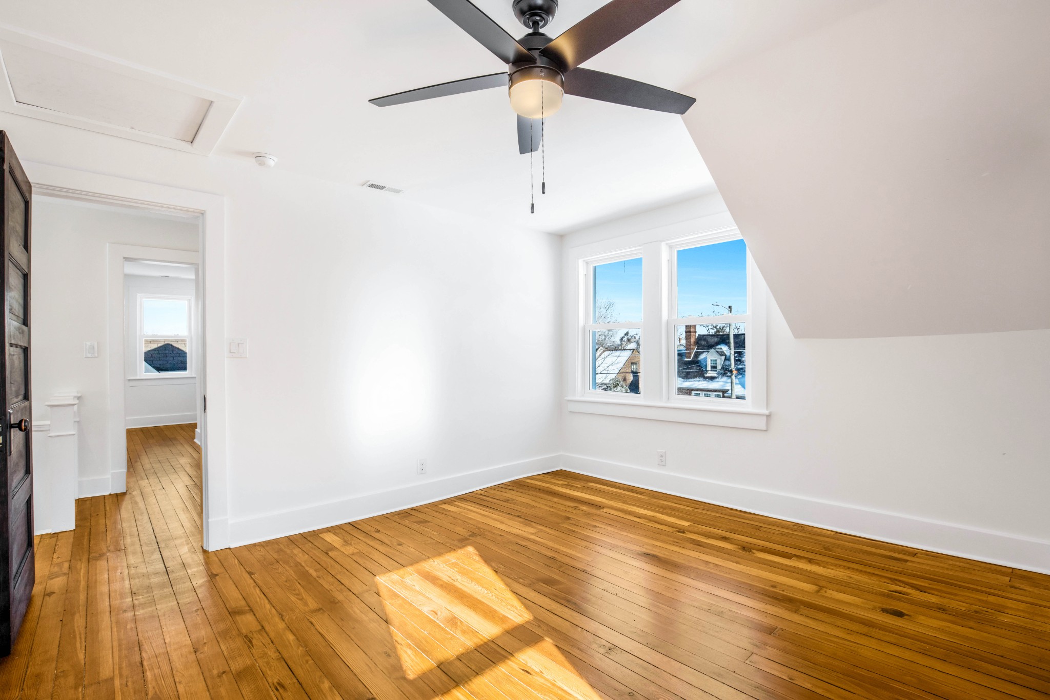 325 North Walnut Street Springfield, TN 37172 - Photo 26 of 34 a view of a bedroom with wooden floor and a ceiling fan