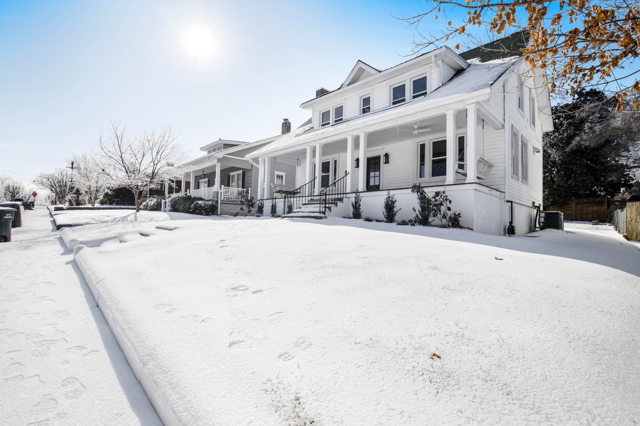 325 North Walnut Street Springfield, TN 37172 - Photo 4 of 34 a view of a white house with a snow on the road