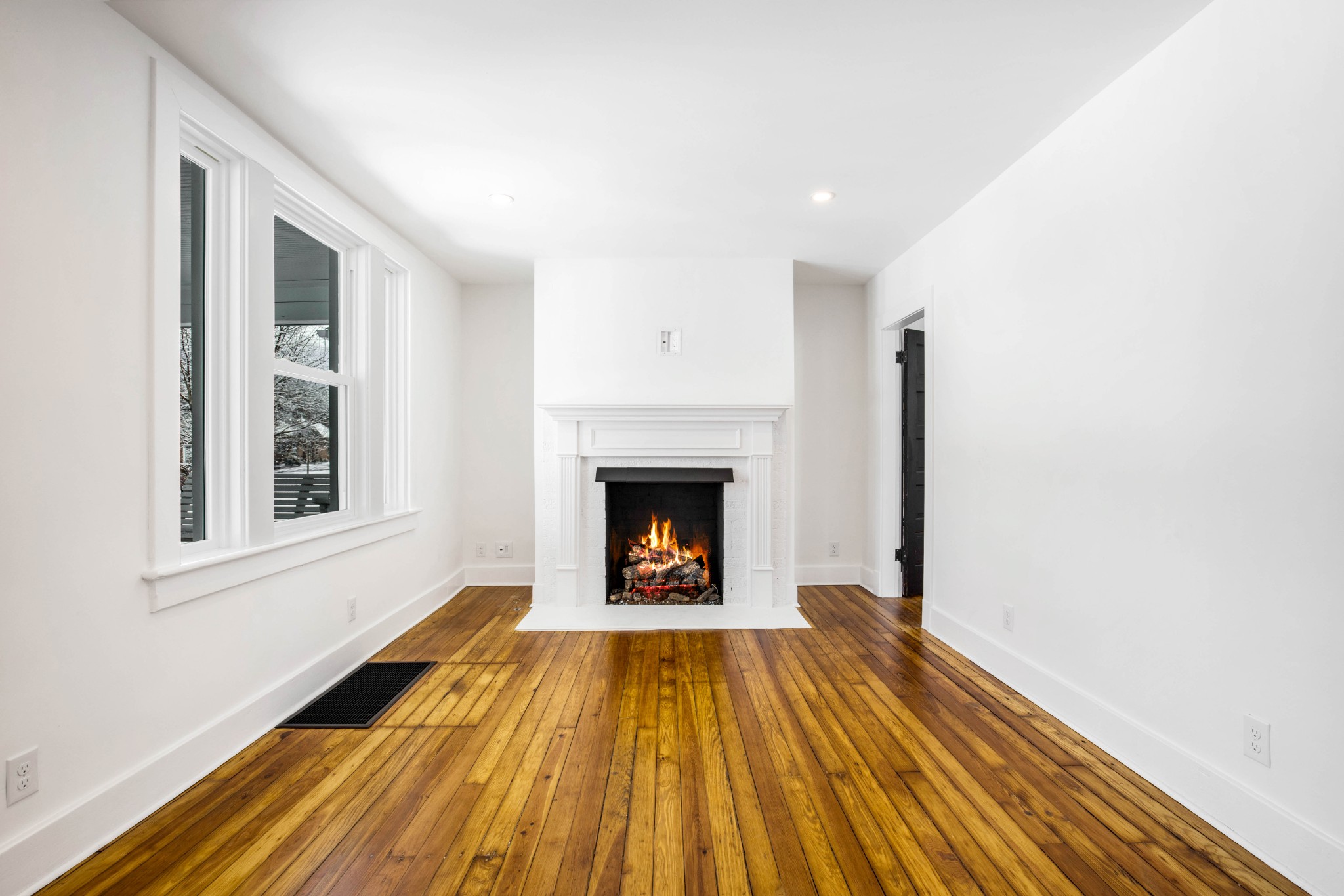 325 North Walnut Street Springfield, TN 37172 - Photo 10 of 34 a view of an empty room with wooden floor fire place