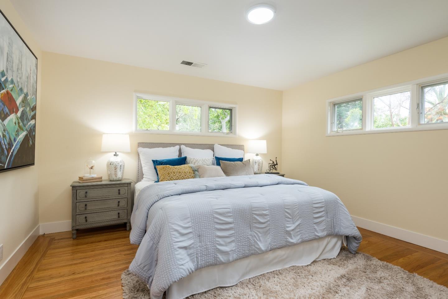 736 Filip Road Los Altos, CA 94024 - Photo 15 of 27 a bedroom with a bed and a night stand