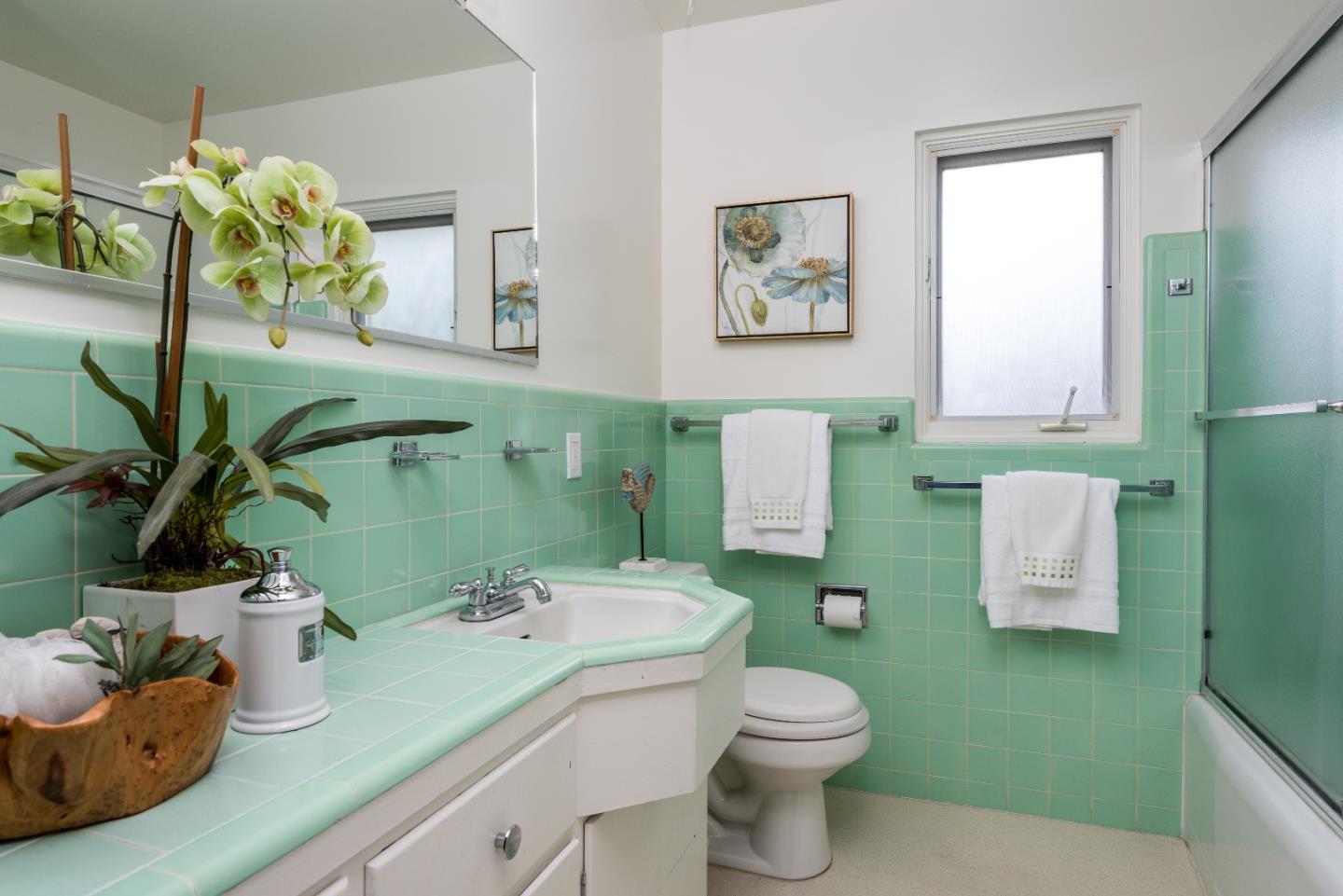736 Filip Road Los Altos, CA 94024 - Photo 18 of 27 a bathroom with a toilet sink and mirror