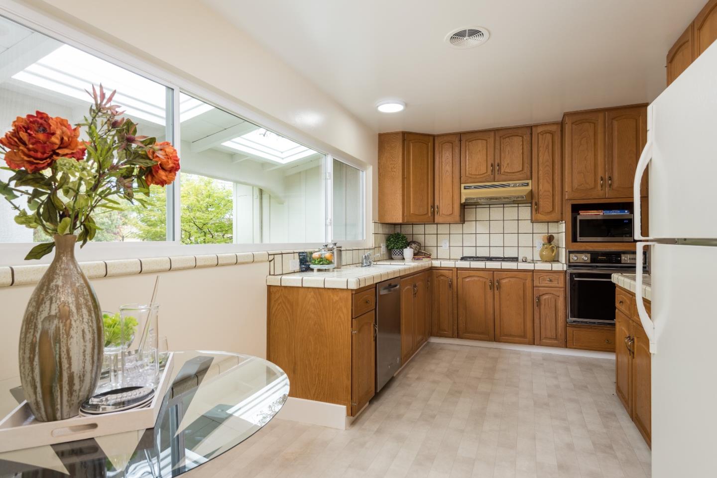 736 Filip Road Los Altos, CA 94024 - Photo 6 of 27 a kitchen with sink cabinets and window