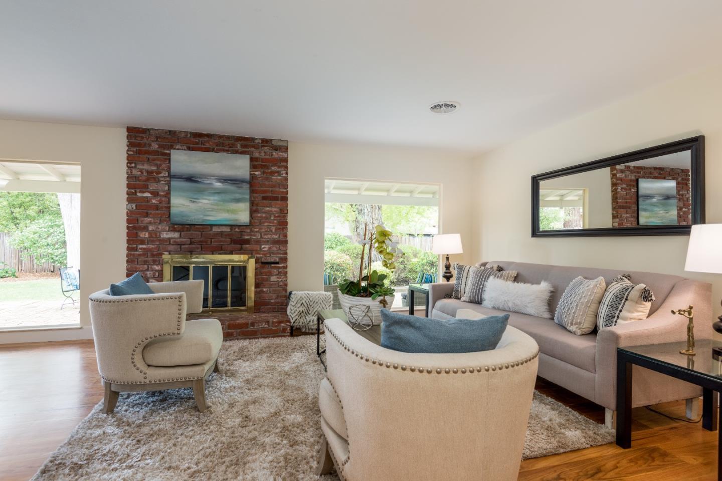 736 Filip Road Los Altos, CA 94024 - Photo 8 of 27 a living room with furniture a window and a potted plant